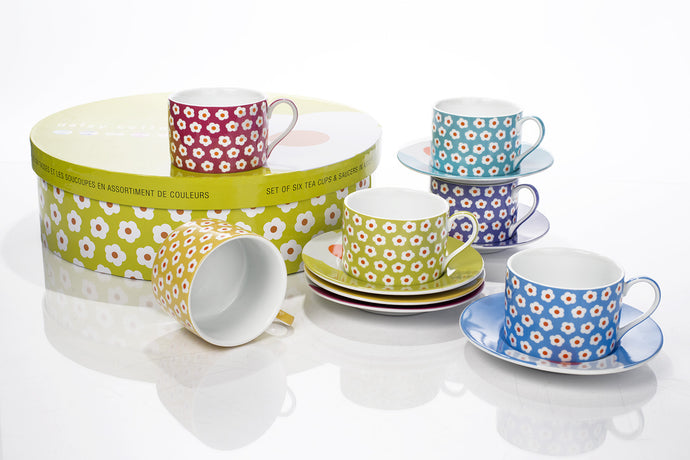 Assorted Daisy Tea Set Fine Porcelain, comes in lime green, yellow, light blue, and purple. Comes in its own Satined-lined hatbox with elegant and pretty artwork.